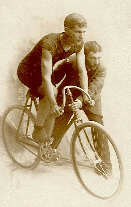 Paul Smith on bike with Clark S. Smith